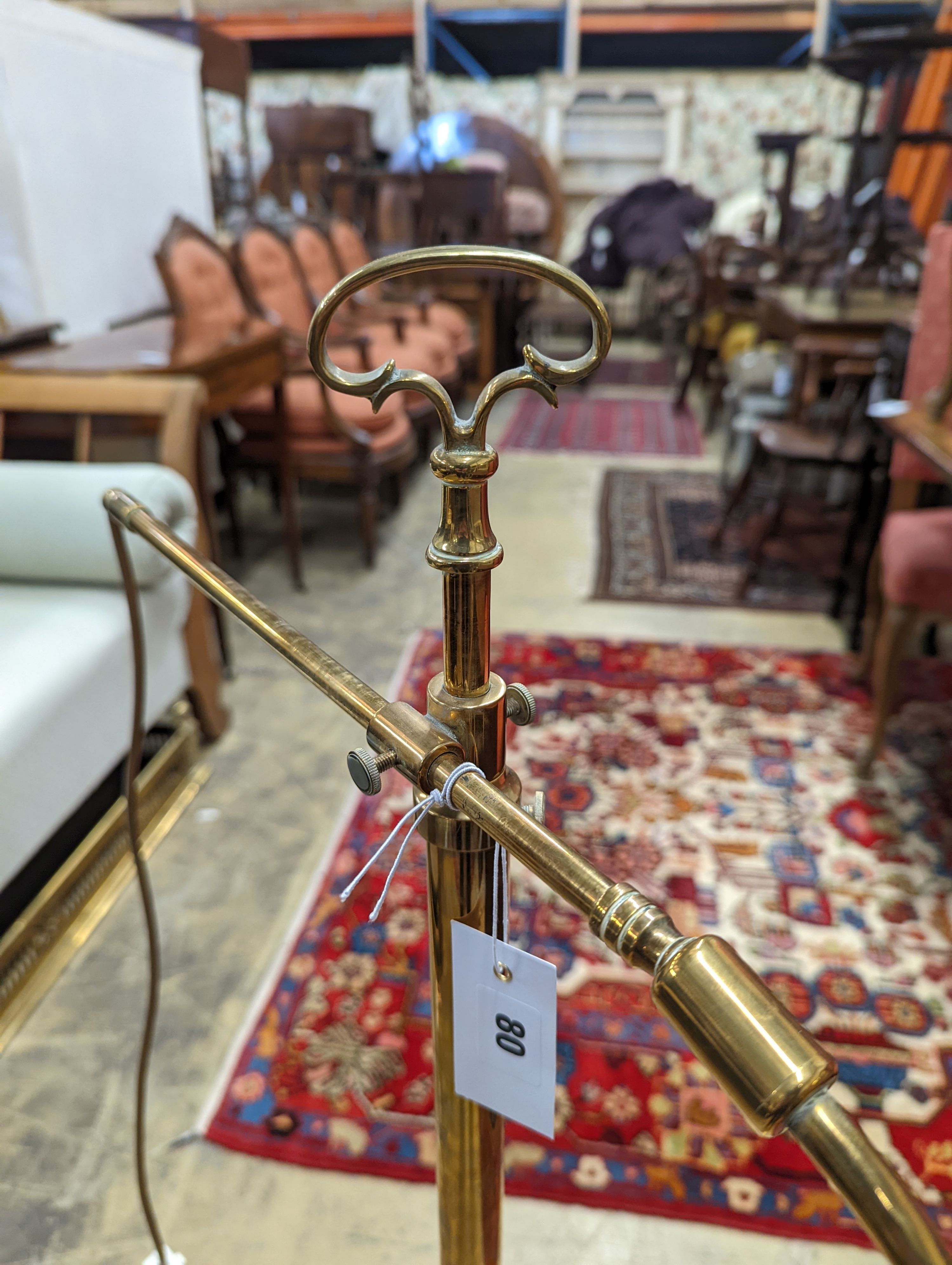 An Edwardian brass telescopic floor lamp converted to electricity